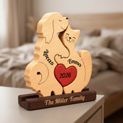 Personalized wooden dog and cat puzzle figurine on a dark base, engraved with the names