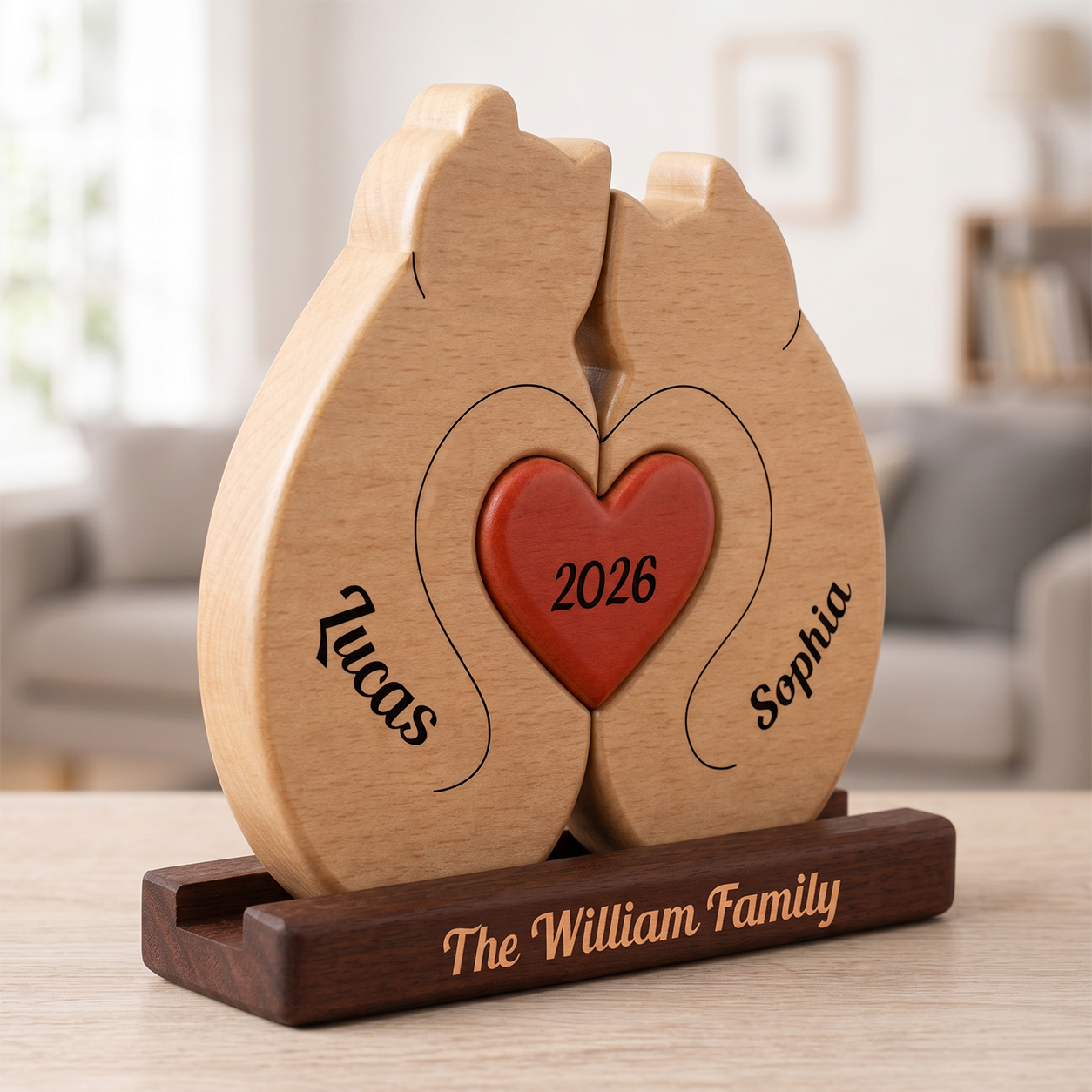 Wooden heart-shaped decoration with engraved names and year on a wooden stand, placed on a table.
