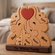 Wooden family puzzle with engraved names on a wooden base, set against a blurred indoor background.