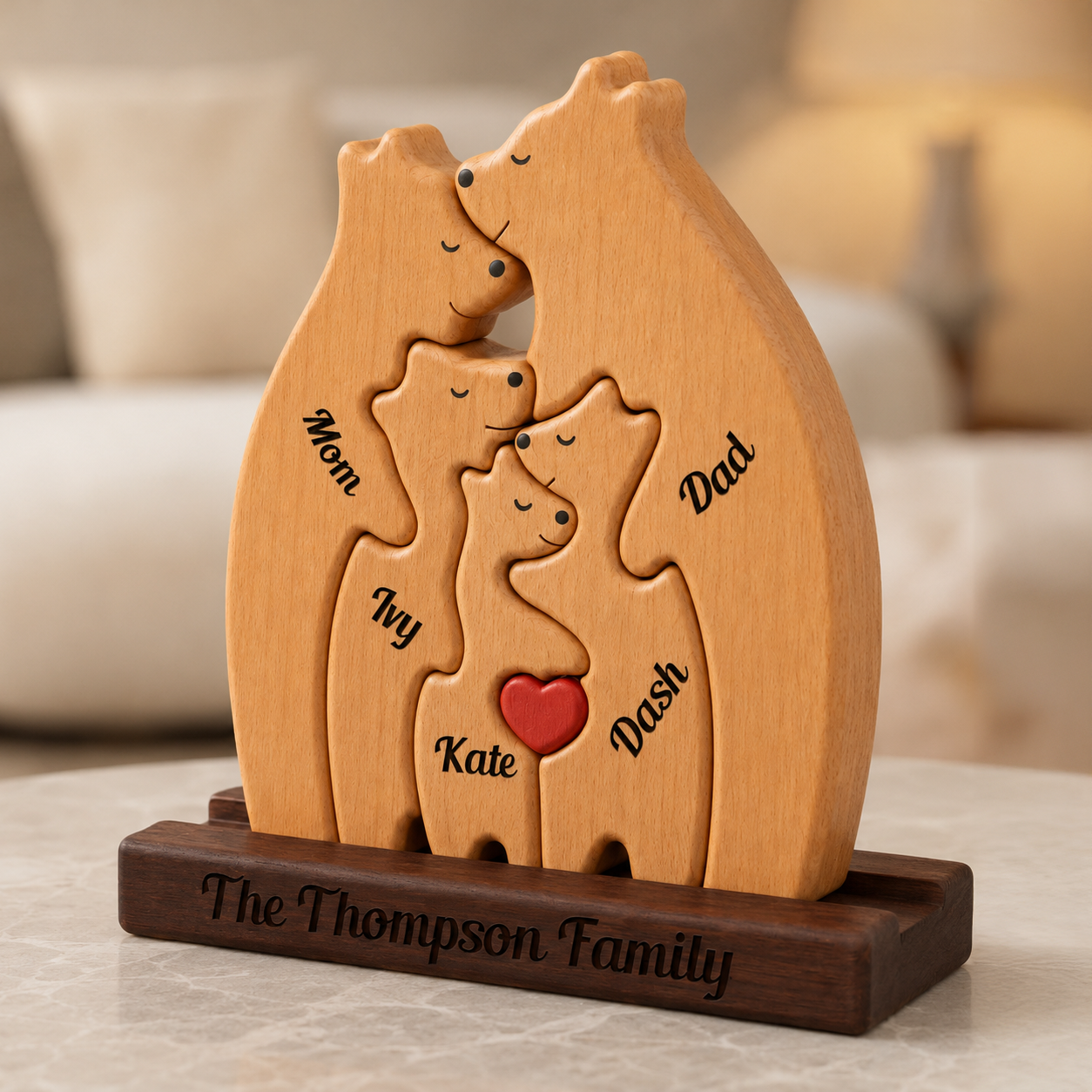 Wooden family bear sculpture with engraved names on a blurred background
