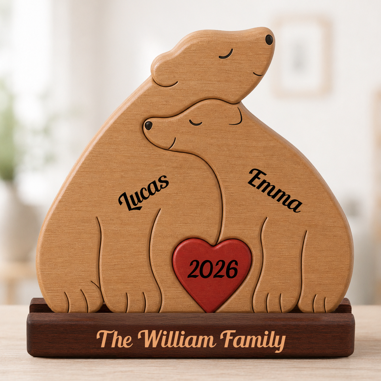 Wooden sculpture of two bears embracing with a heart and names engraved, on a blurred background.