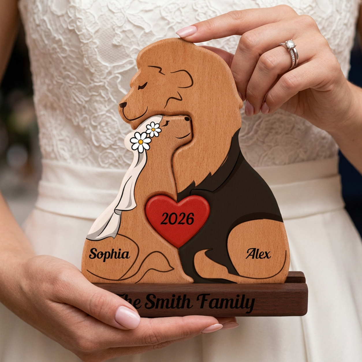 Wooden Lion couple heart, personalized with names and year, held by a person.