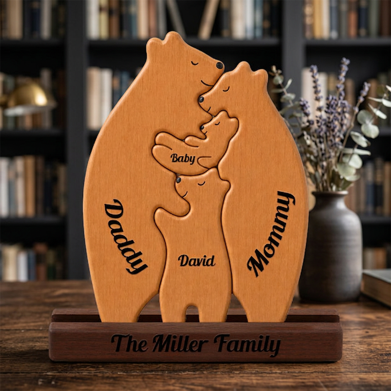 Wooden bear family sculpture with engraved names in a home setting