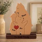 Wooden bear family ornament with engraved names on a wooden stand.