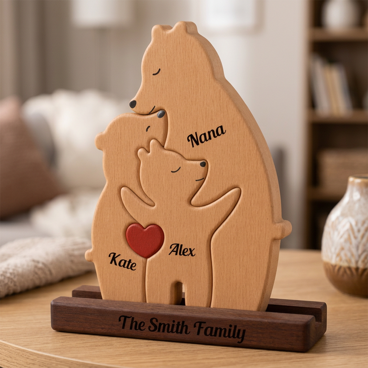 Wooden bear family sculpture with engraved names on a wooden stand