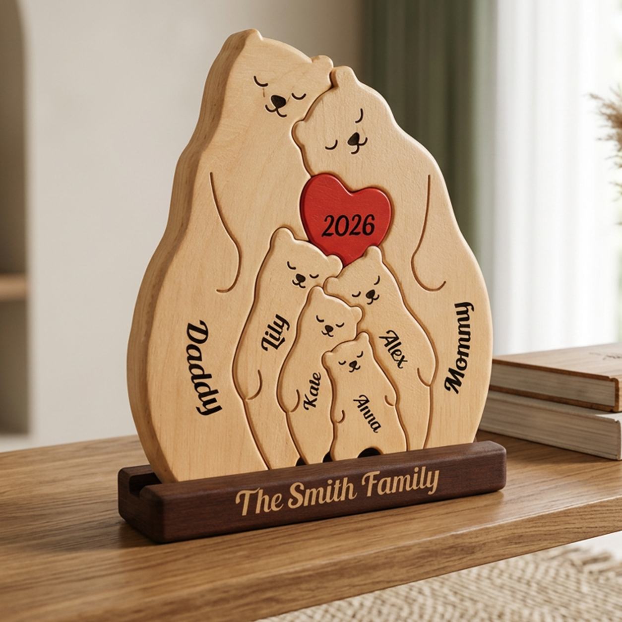 Personalized wooden family plaque shaped like three bears, engraved with names and the year 2026, displayed on a dark wooden base on a tabletop.
