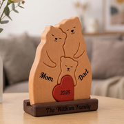 Wooden family figurine names, placed on a surface.