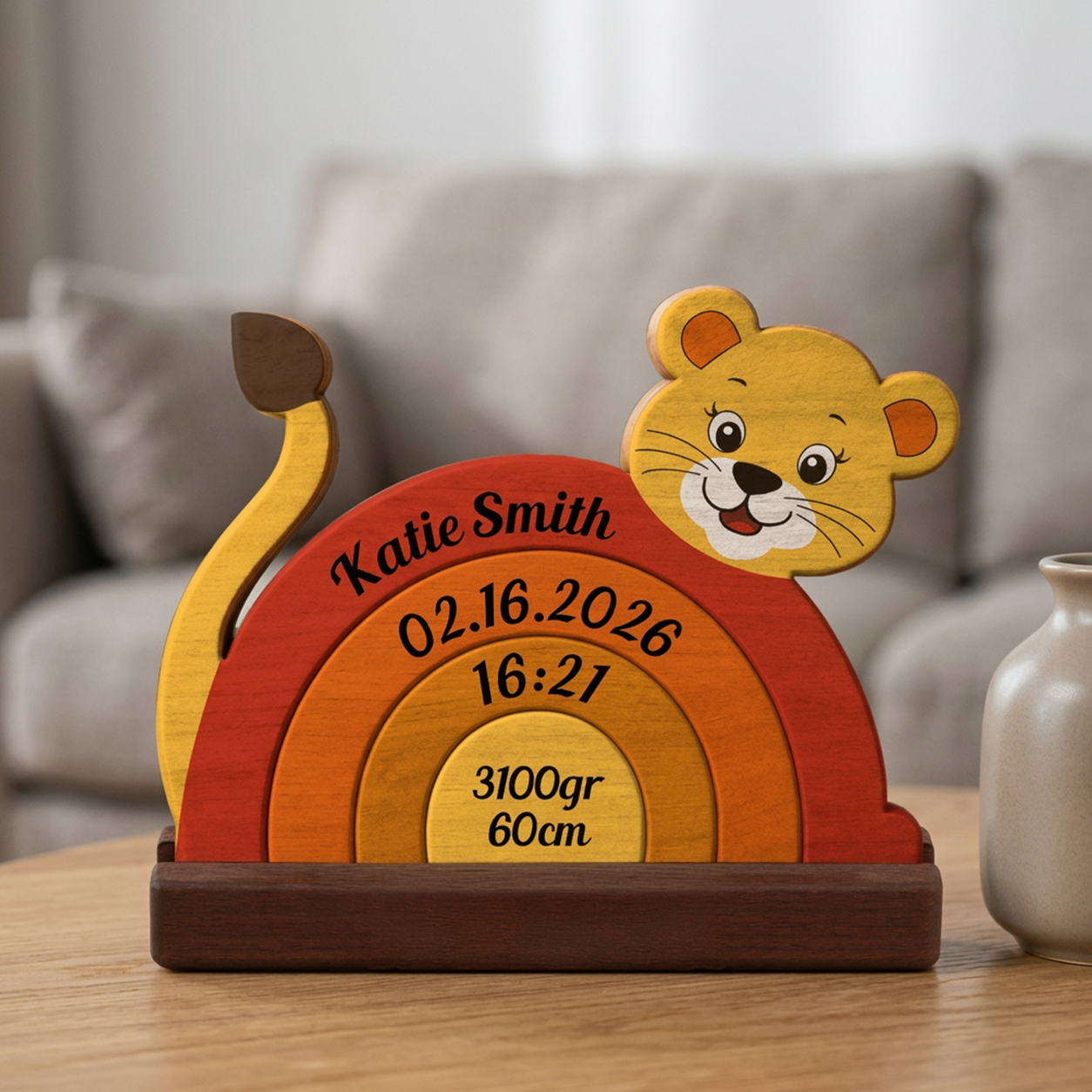 Wooden baby milestone plaque with lion design on a table