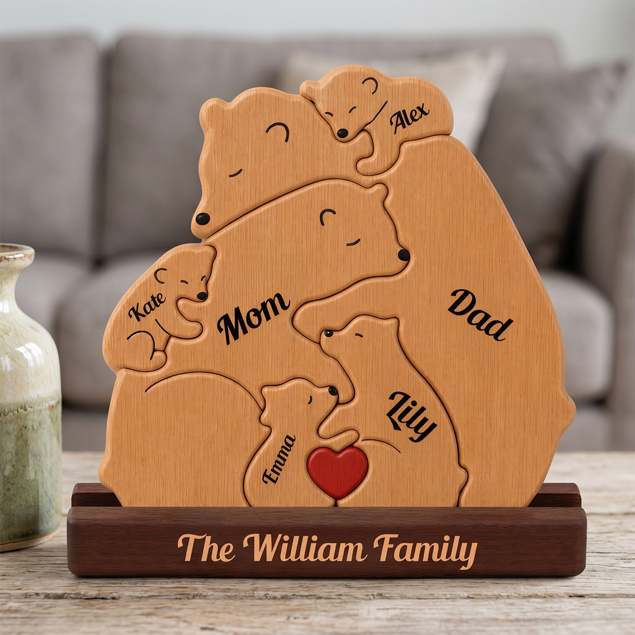 Wooden family plaque with bear illustrations and names on a wooden stand.