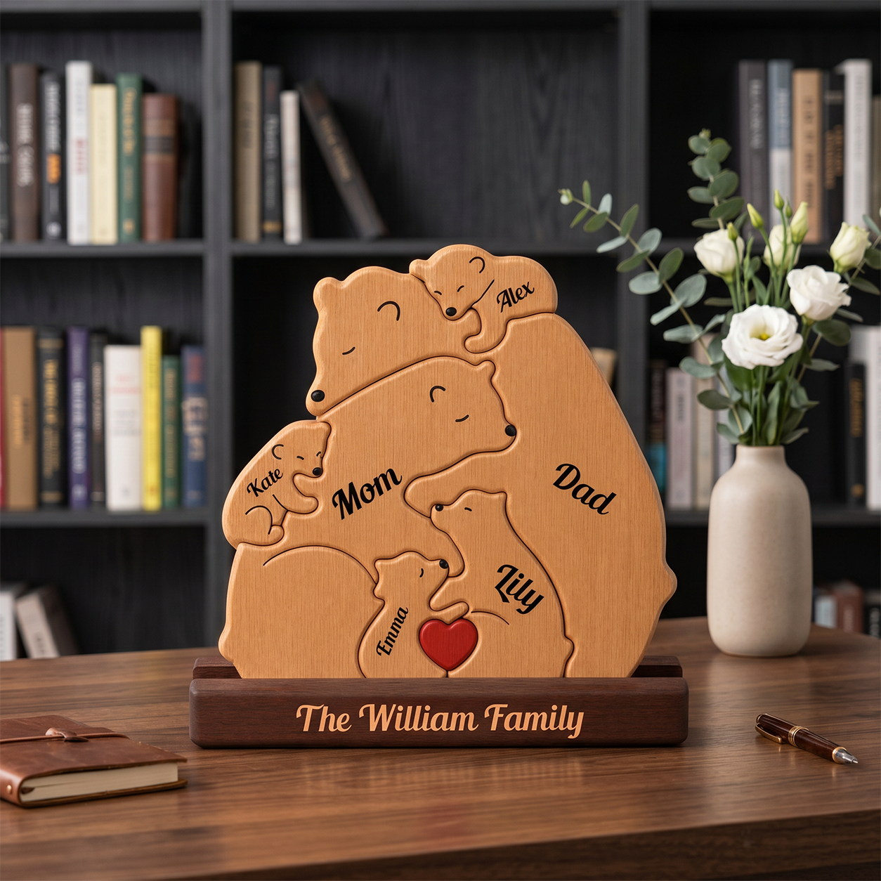 Wooden family plaque with engraved names on a wooden table with a bookshelf and flowers in the background.