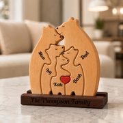 Wooden family puzzle with bear shapes on a marble surface