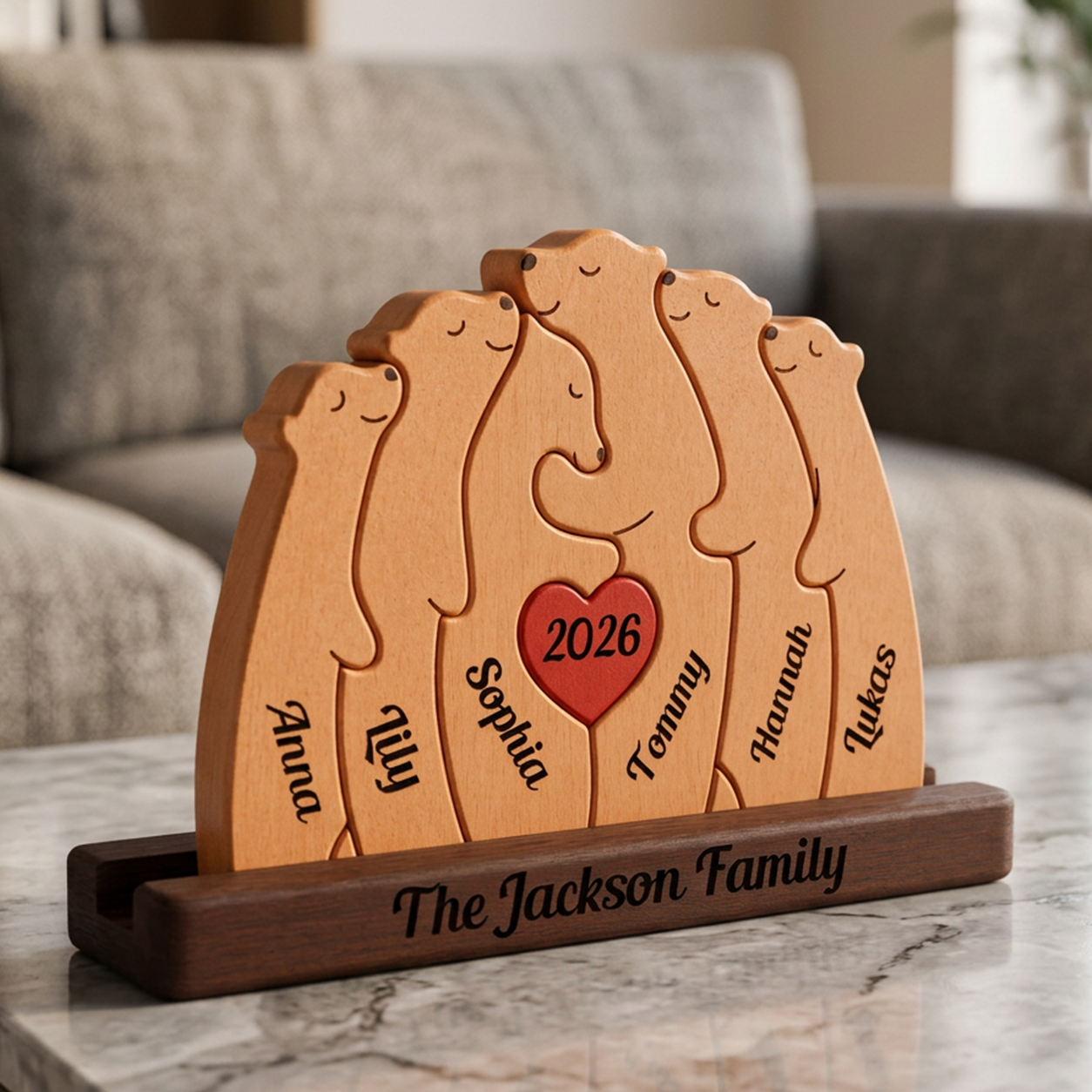 Wooden family portrait with engraved names and year on a marble surface