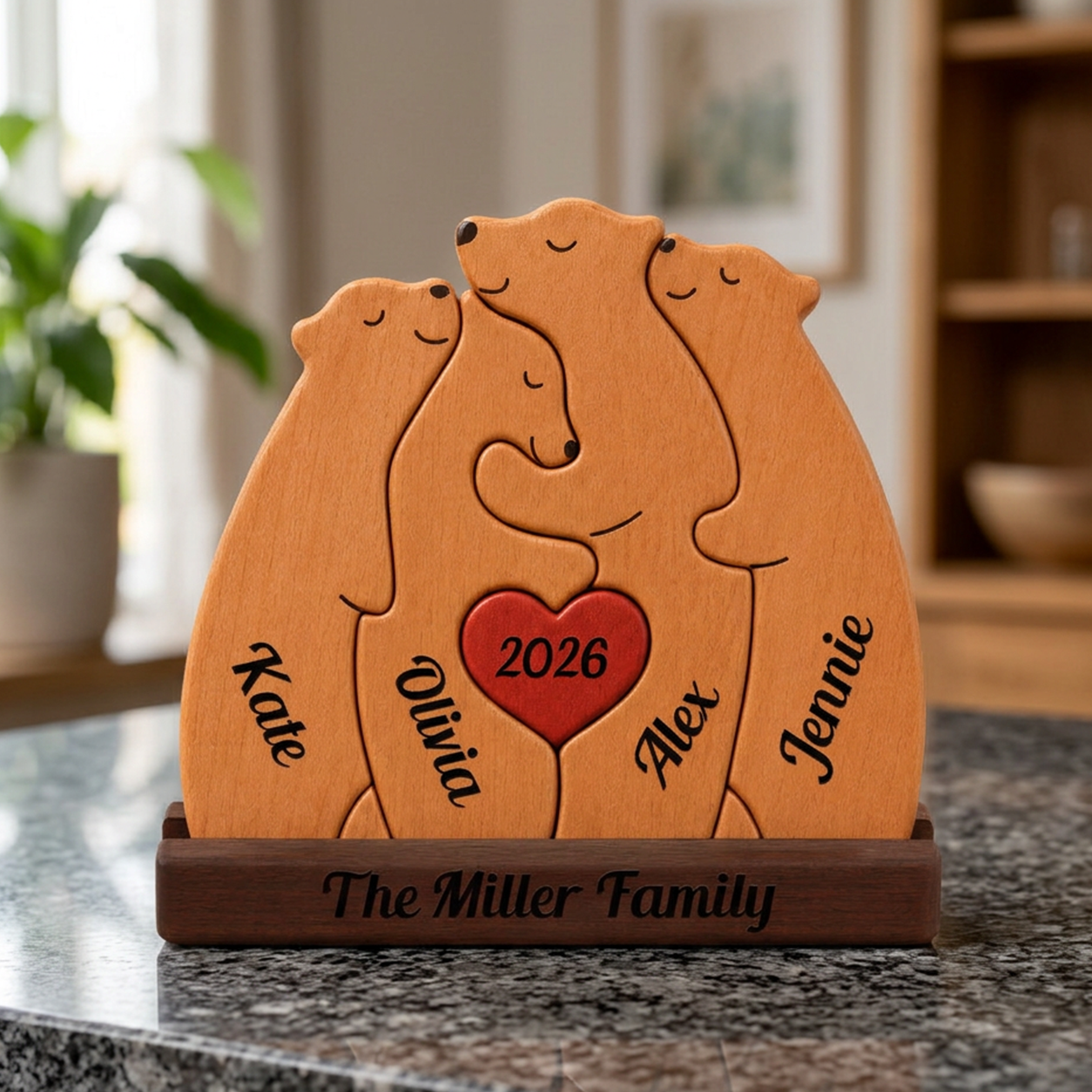 Wooden family portrait with four bears and a heart, personalized with names and the year 2026, on a marble surface.