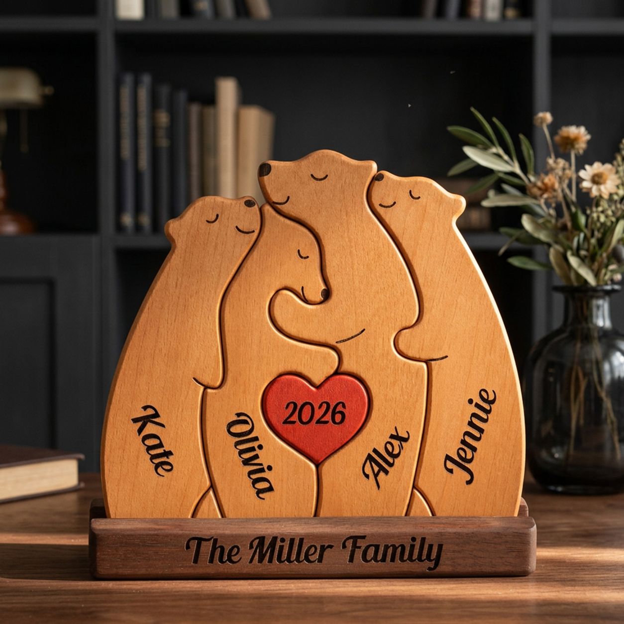 Wooden family plaque with four bears hugging and a heart in the center, engraved with names and the year 2026, on a wooden surface.