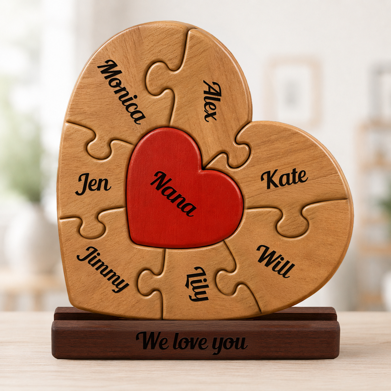 Wooden heart-shaped puzzle with names on a stand, featuring a red heart in the center.