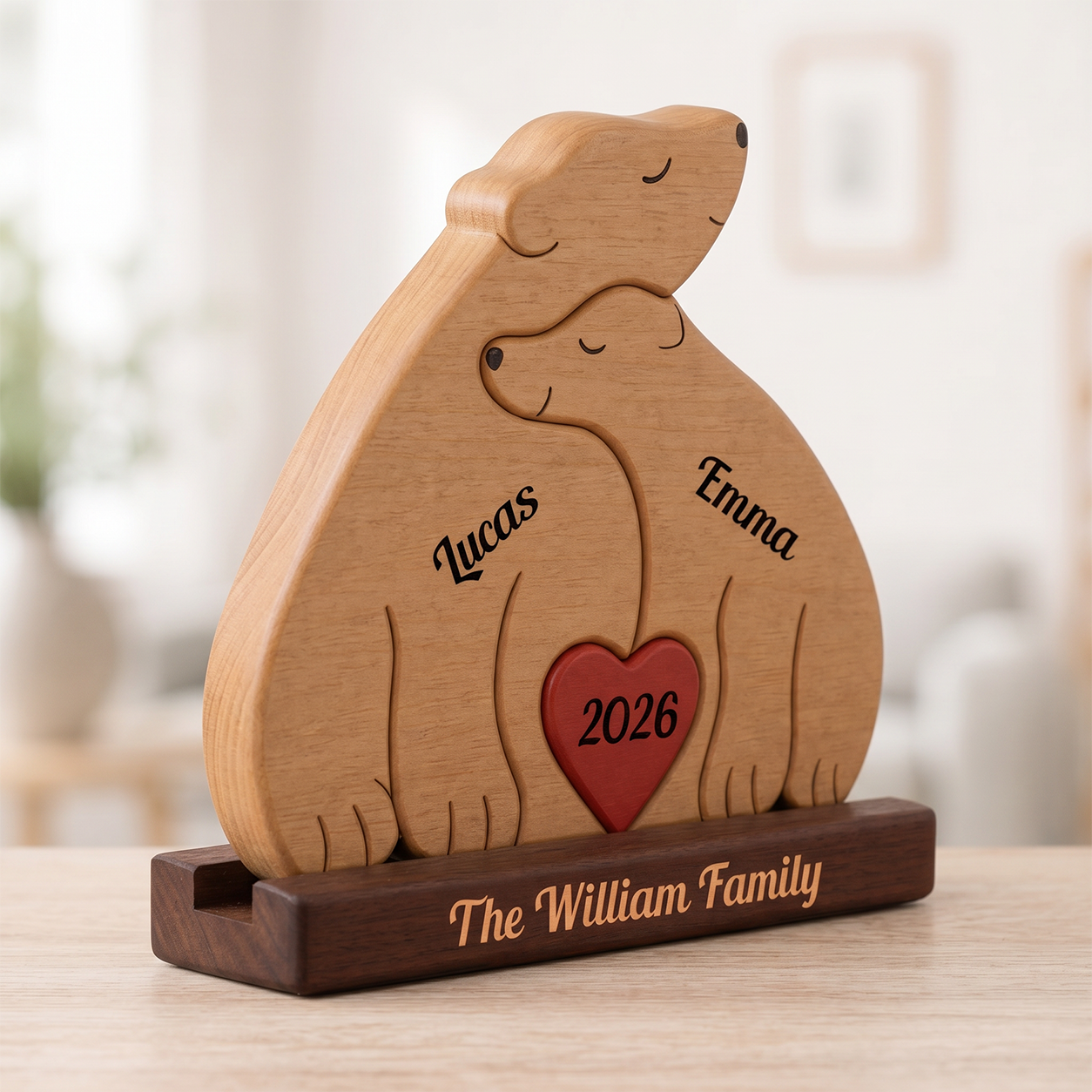Wooden sculpture of two bears with a heart and names engraved, on a blurred background.